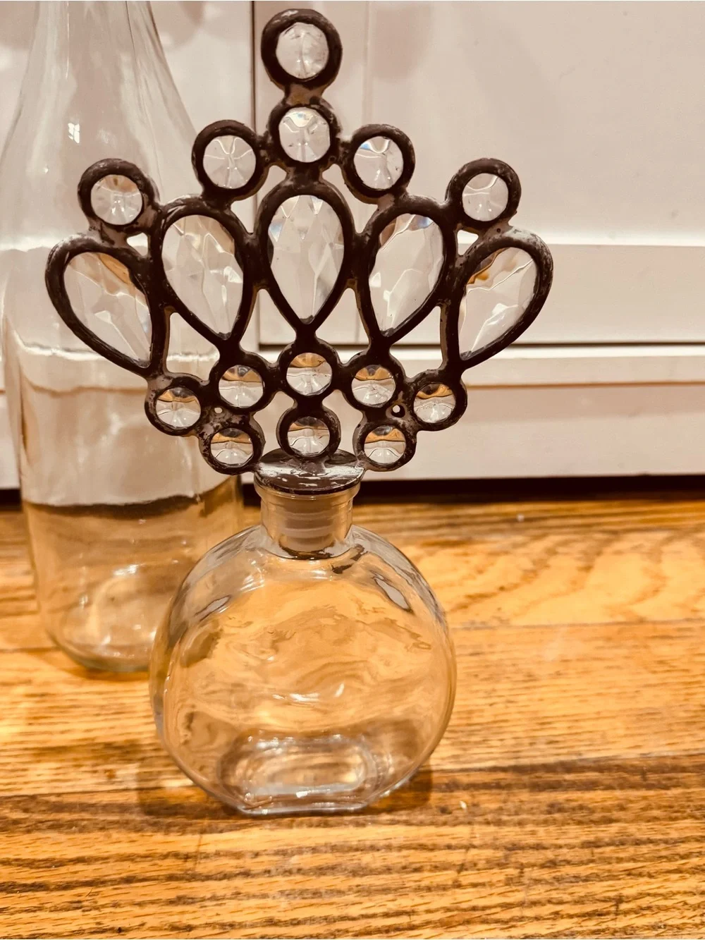 Vintage Decorative Glass Bottle Trio with Fleur & Crown Stoppers - Clear